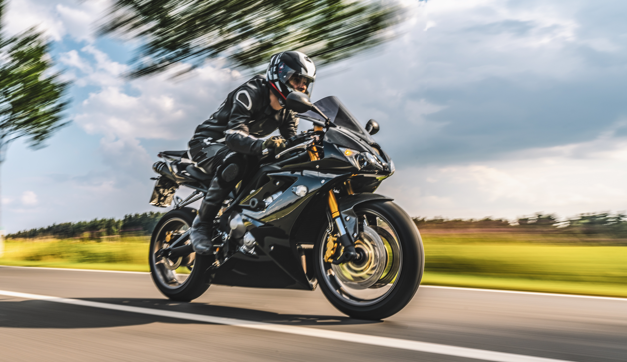 motorbike on the road driving fast. having fun on the empty highway on a motorcycle journey. copyspace for your individual text. motion blur effect